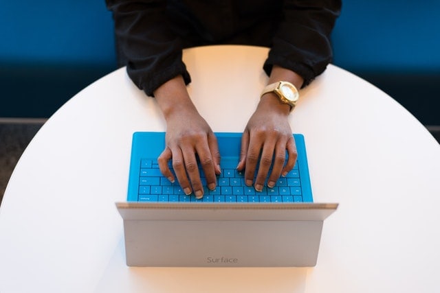 Hiring manageHiring manager typing a job description, on her laptop, to attract high quality candidates for an open positionr writing a job description to attract high quality candidates for an open position