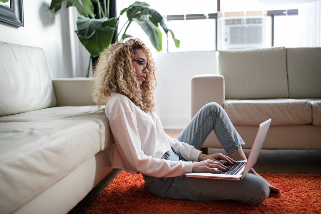 A woman managing underperforming employees while working remotely
