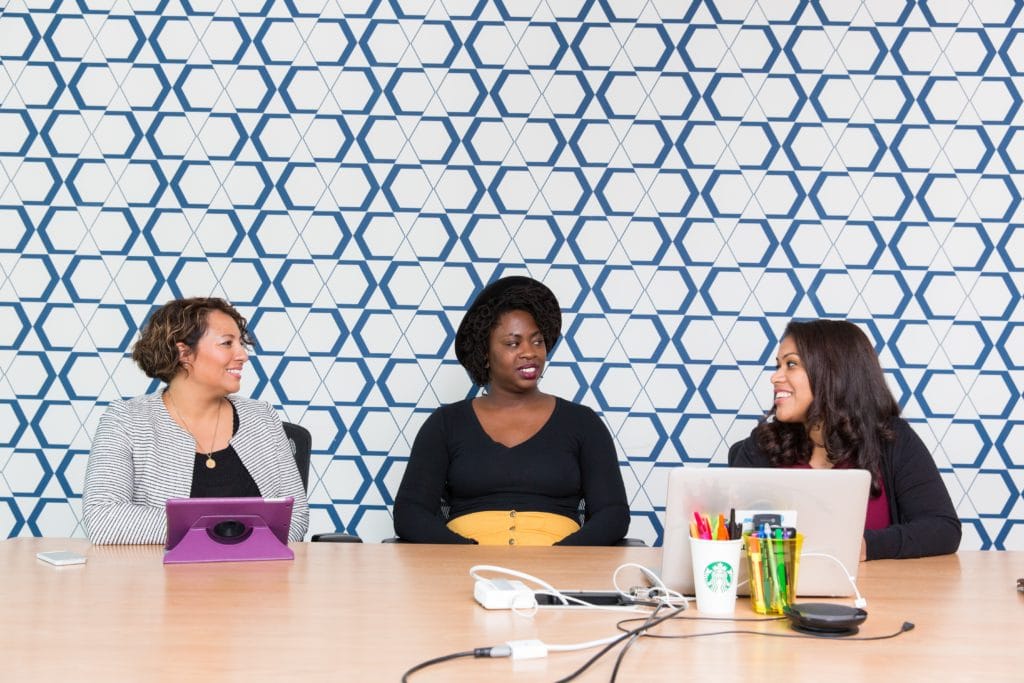 female leaders strategizing about hiring women in tech
