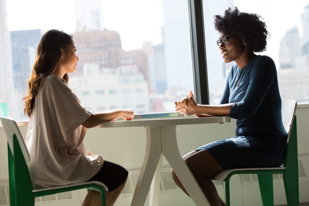 two women in a job interview using candidate net promoter score