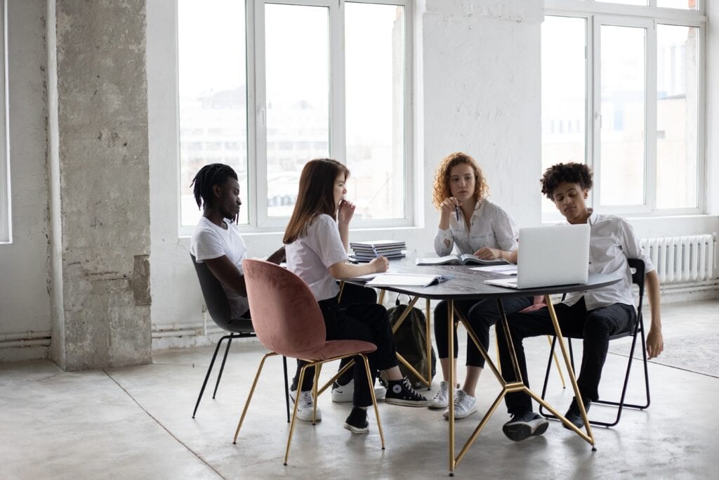 Workers discussing how to incorporate data into their hiring process