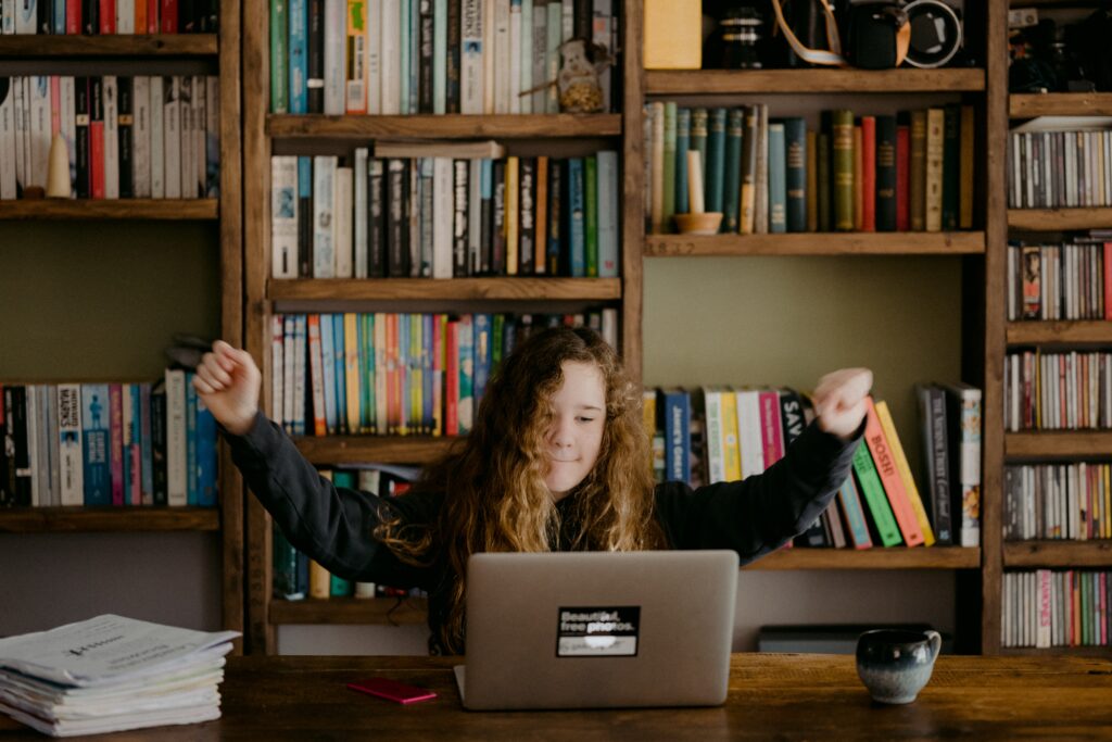 a happy employee upskilling to grow at work