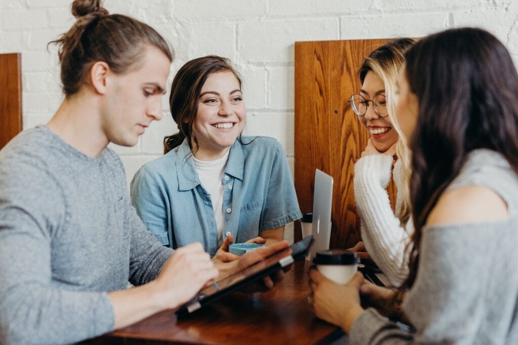 Happy workers in the workplace with high employee retention