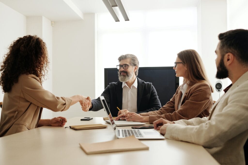 Candidate shaking hands with a human resources leader