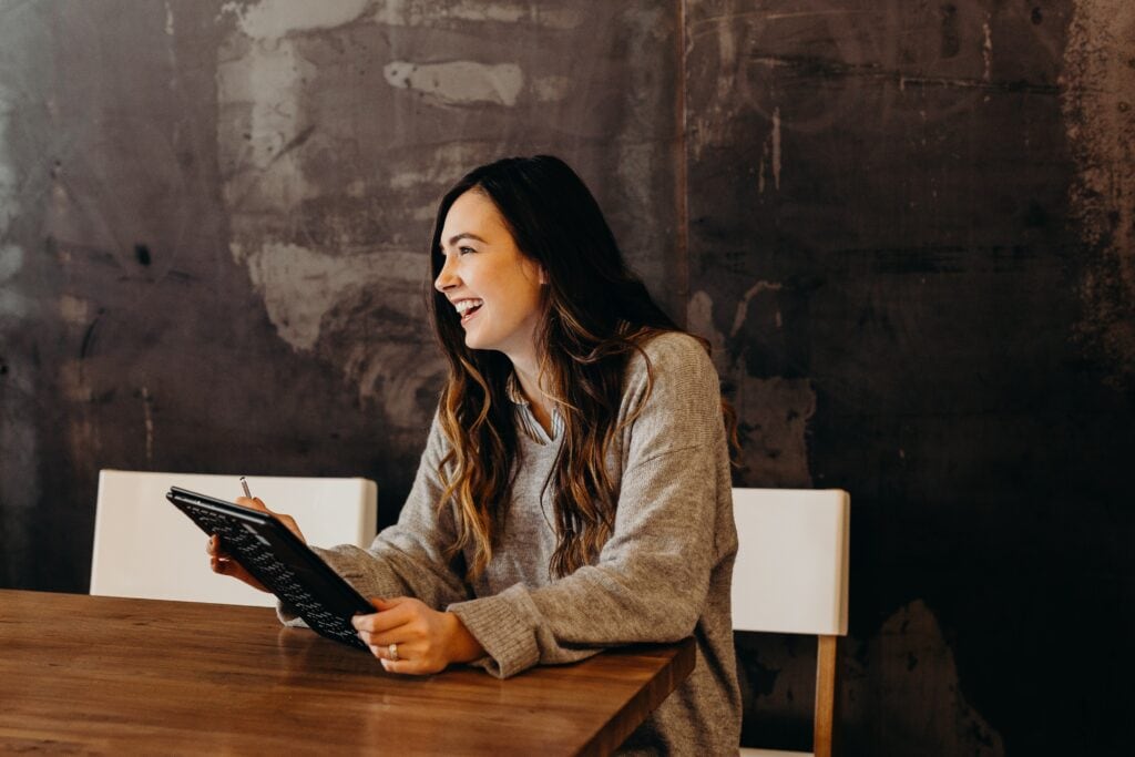 A happy recruiter using Cangrade’s talent management solutions