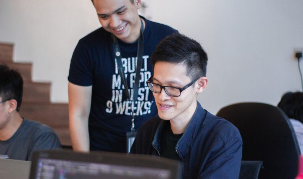 a hiring manager and job applicant during skills assessment testing