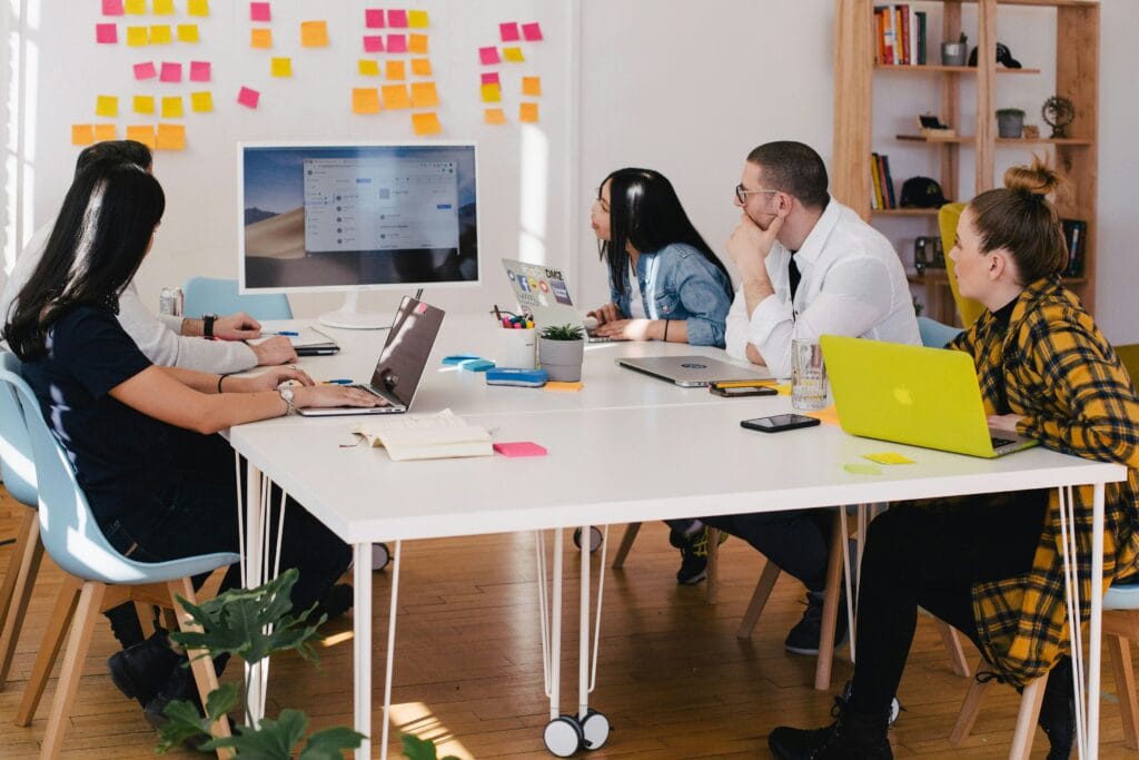 HR managers reviewing talent intelligence data on a computer screen