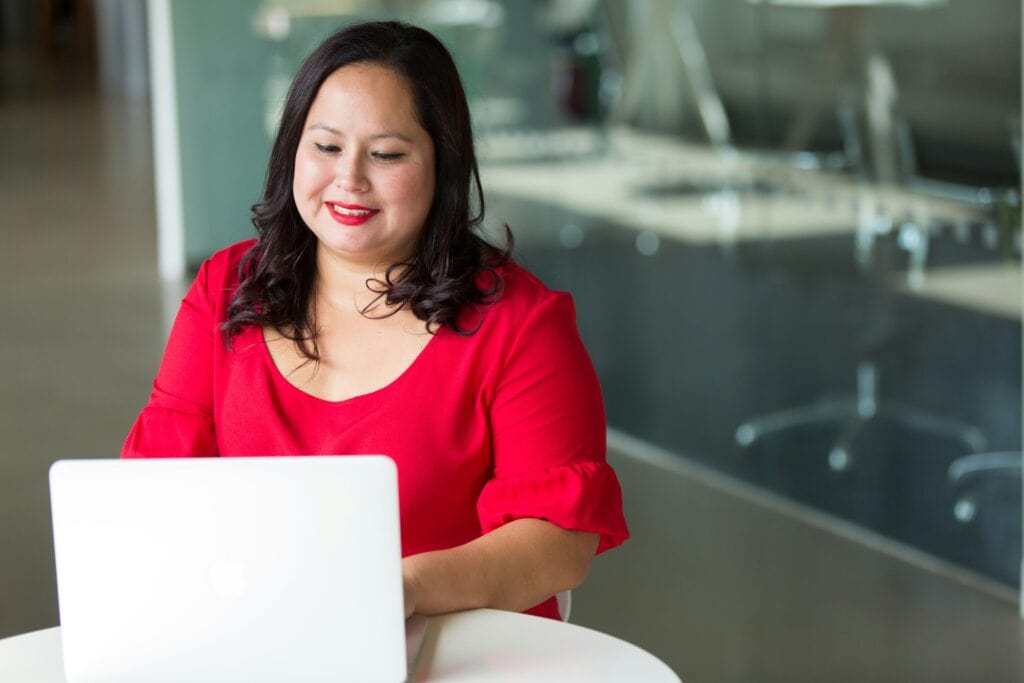 An HR manager sitting at a laptop using talent intelligence software.