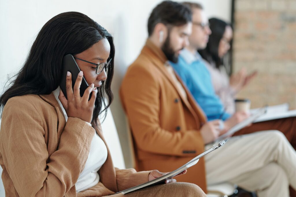 A woman evaluating the transparency and auditability of AI hiring technology